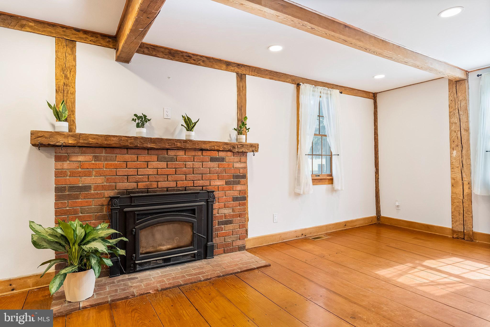 107 Millstone Road Millstone Township, NJ 08535 - Photo 10 of 28 Wood fireplace in living room