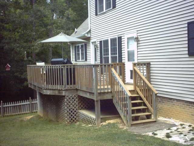 1287 Chub Lake Road Roxboro, NC 27574 - Photo 4 of 10 a view of a house with a yard and deck