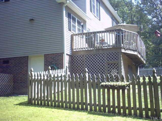 1287 Chub Lake Road Roxboro, NC 27574 - Photo 5 of 10 a view of a house with wooden fence