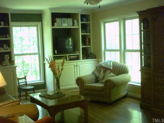 1287 Chub Lake Road Roxboro, NC 27574 - Photo 8 of 10 a living room with furniture and a large window