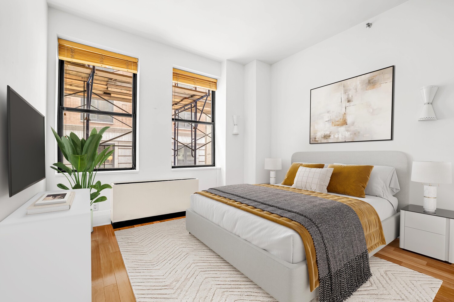 71 Nassau Street, Unit 3B Manhattan, NY 10038 - Photo 5 of 9 a bedroom with a large bed and a potted plant