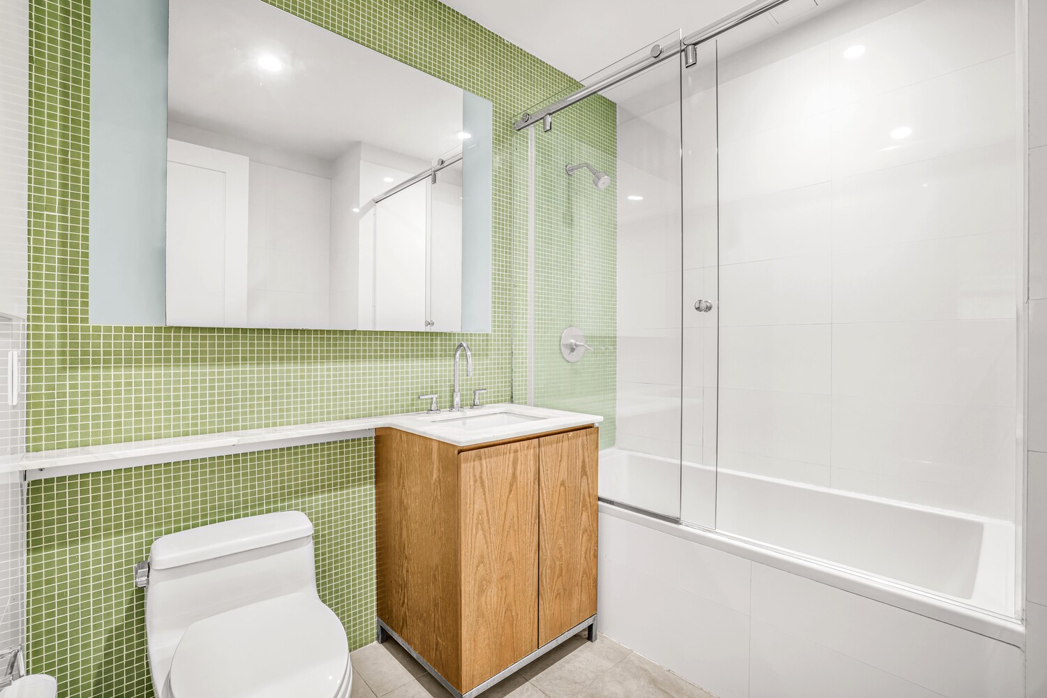 71 Nassau Street, Unit 3B Manhattan, NY 10038 - Photo 8 of 9 a bathroom with a sink a toilet and shower