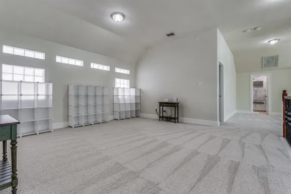 a view of an empty room with windows