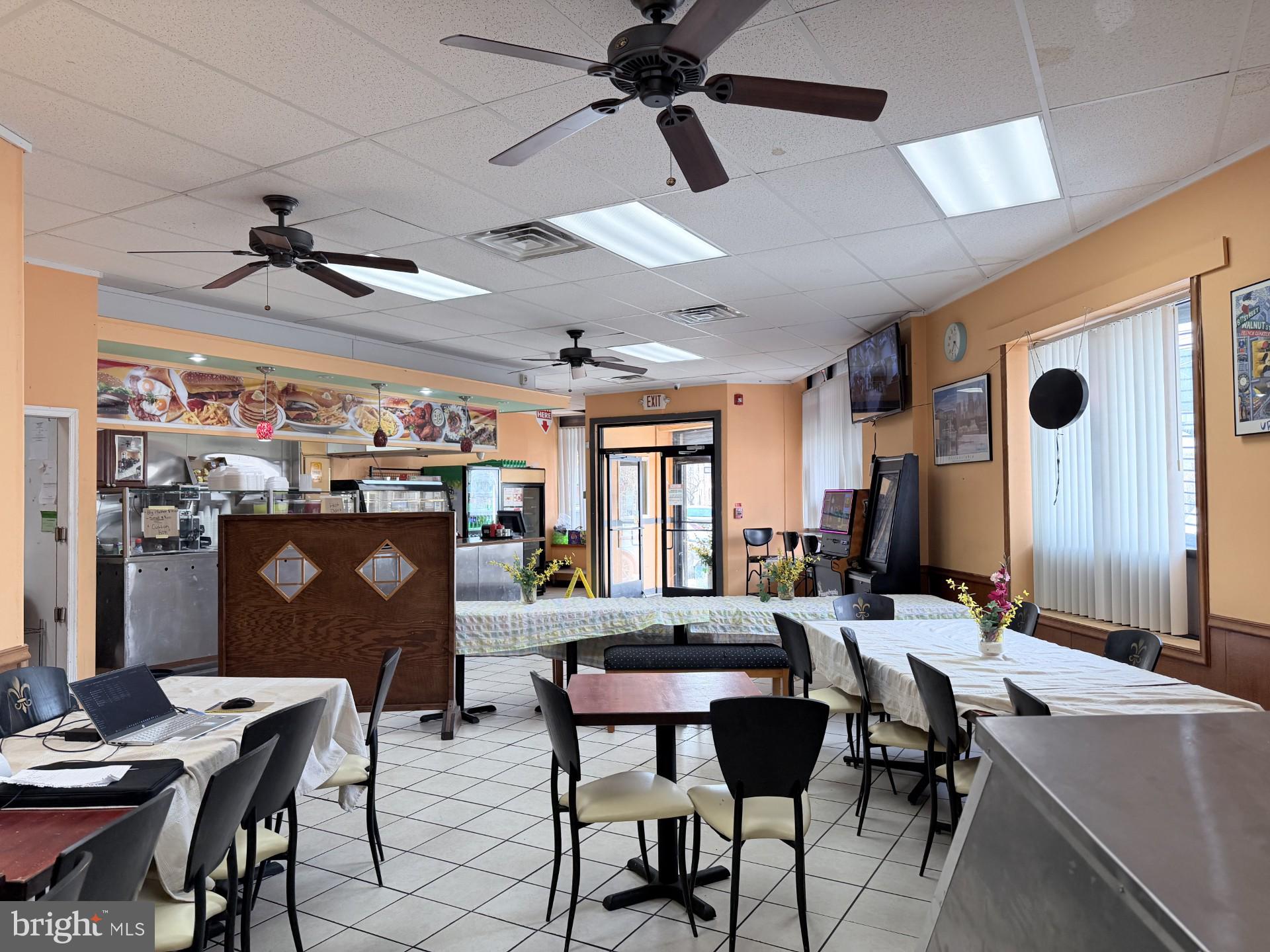 1438 Federal Street Philadelphia, PA 19146 - Photo 6 of 10 a view of a dining room with furniture and window