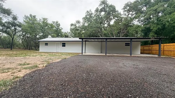 a view of backyard with green space