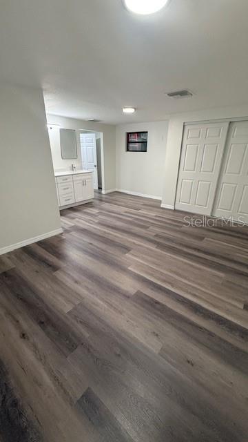 15535 Little Ranch Road Spring Hill, FL 34610 - Photo 12 of 46 a view of empty room with wooden floor