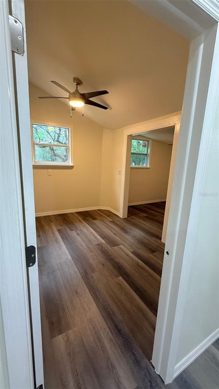 15535 Little Ranch Road Spring Hill, FL 34610 - Photo 15 of 46 an empty room with wooden floor and windows