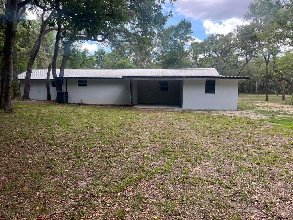 15535 Little Ranch Road Spring Hill, FL 34610 - Photo 21 of 46 a view of a backyard