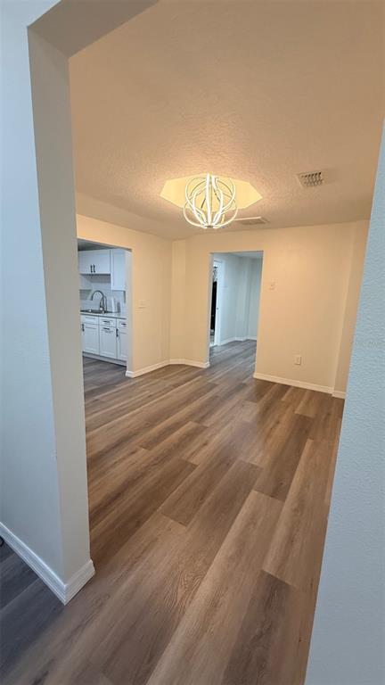 15535 Little Ranch Road Spring Hill, FL 34610 - Photo 30 of 46 a view of a room with wooden floor