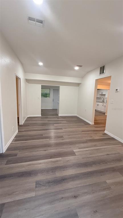 15535 Little Ranch Road Spring Hill, FL 34610 - Photo 3 of 46 a view of an empty room with wooden floor