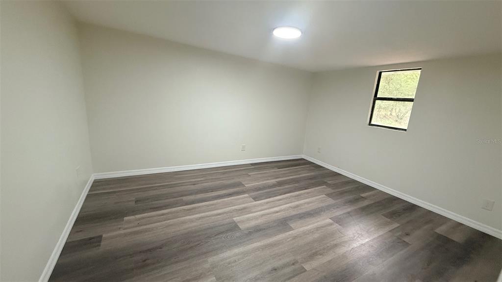 15535 Little Ranch Road Spring Hill, FL 34610 - Photo 32 of 46 an empty room with a window