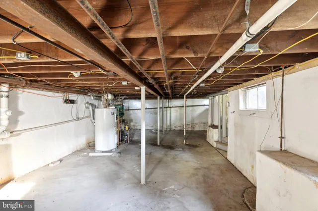 a view of empty room with wooden ceiling