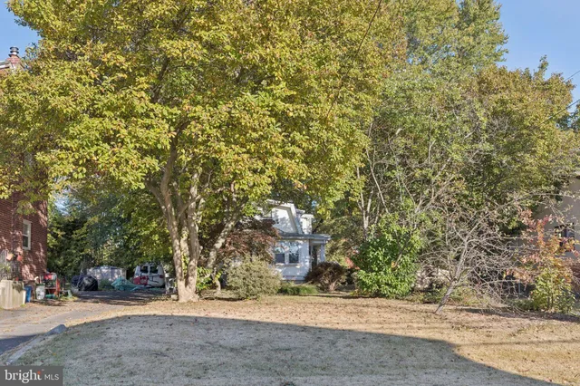 a backyard of a house with a trees