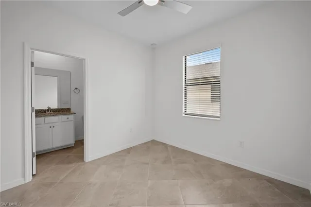 a room with a stove and a refrigerator