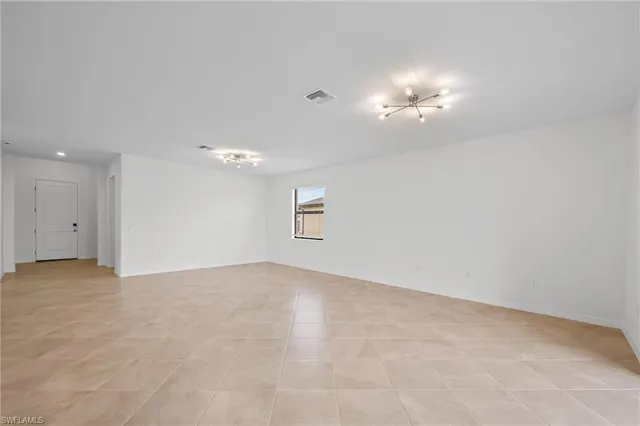 an empty room with a bathroom