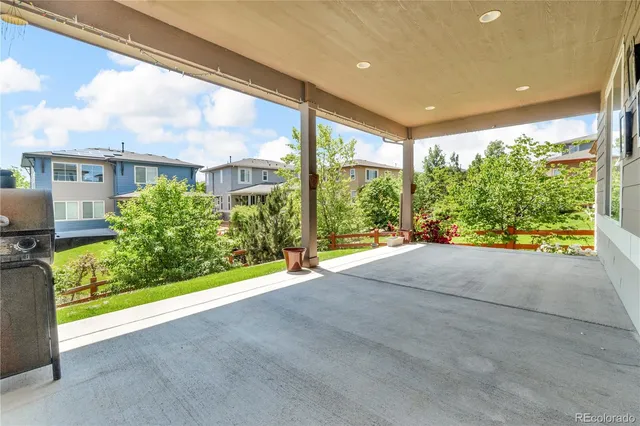 a view of a garden with an outdoor seating space