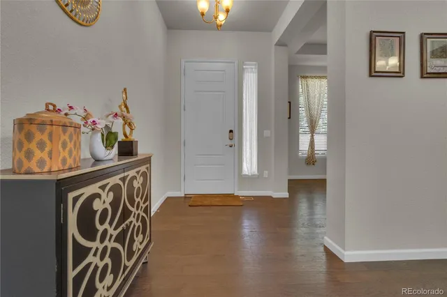 a view of an entryway with wooden floor
