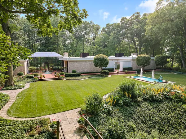 a swimming pool with outdoor seating yard and barbeque oven