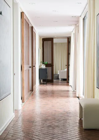 a view of a livingroom with wooden floor and white walls