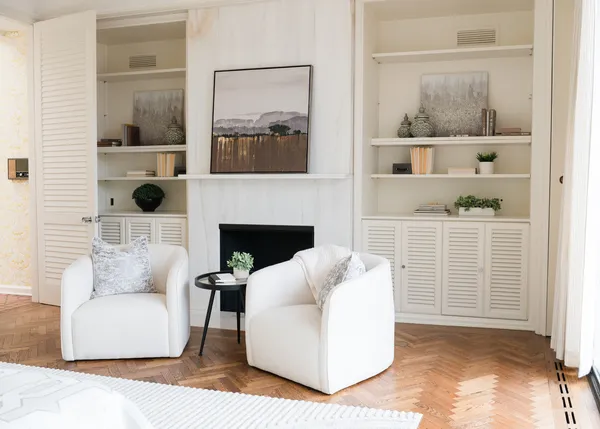 a living room with furniture and a fireplace