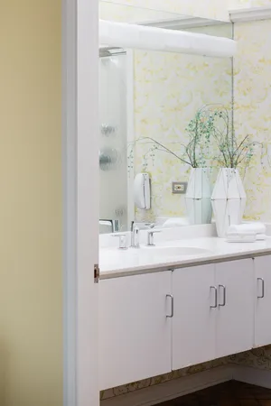 a bathroom with a double vanity sink and a mirror