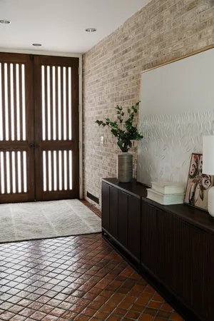 a living room with furniture window and a potted plant