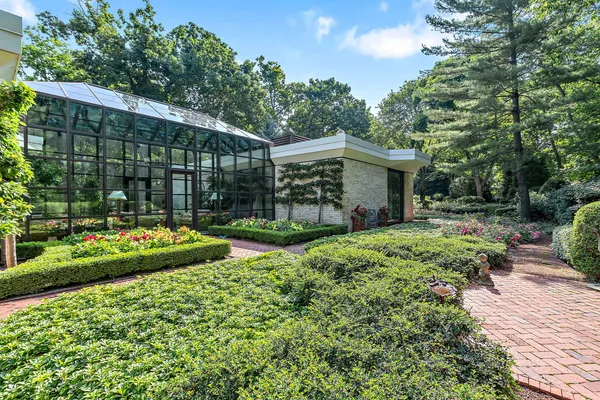 a view of a house with backyard and porch