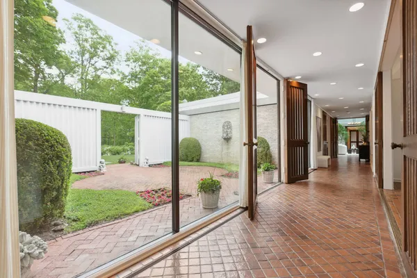 a view of a porch with wooden floor and outdoor space