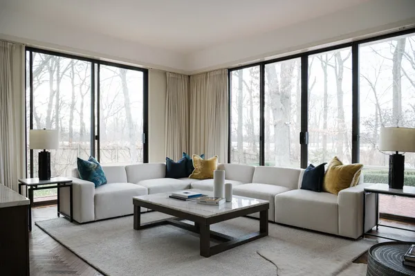 a living room with furniture and a large window