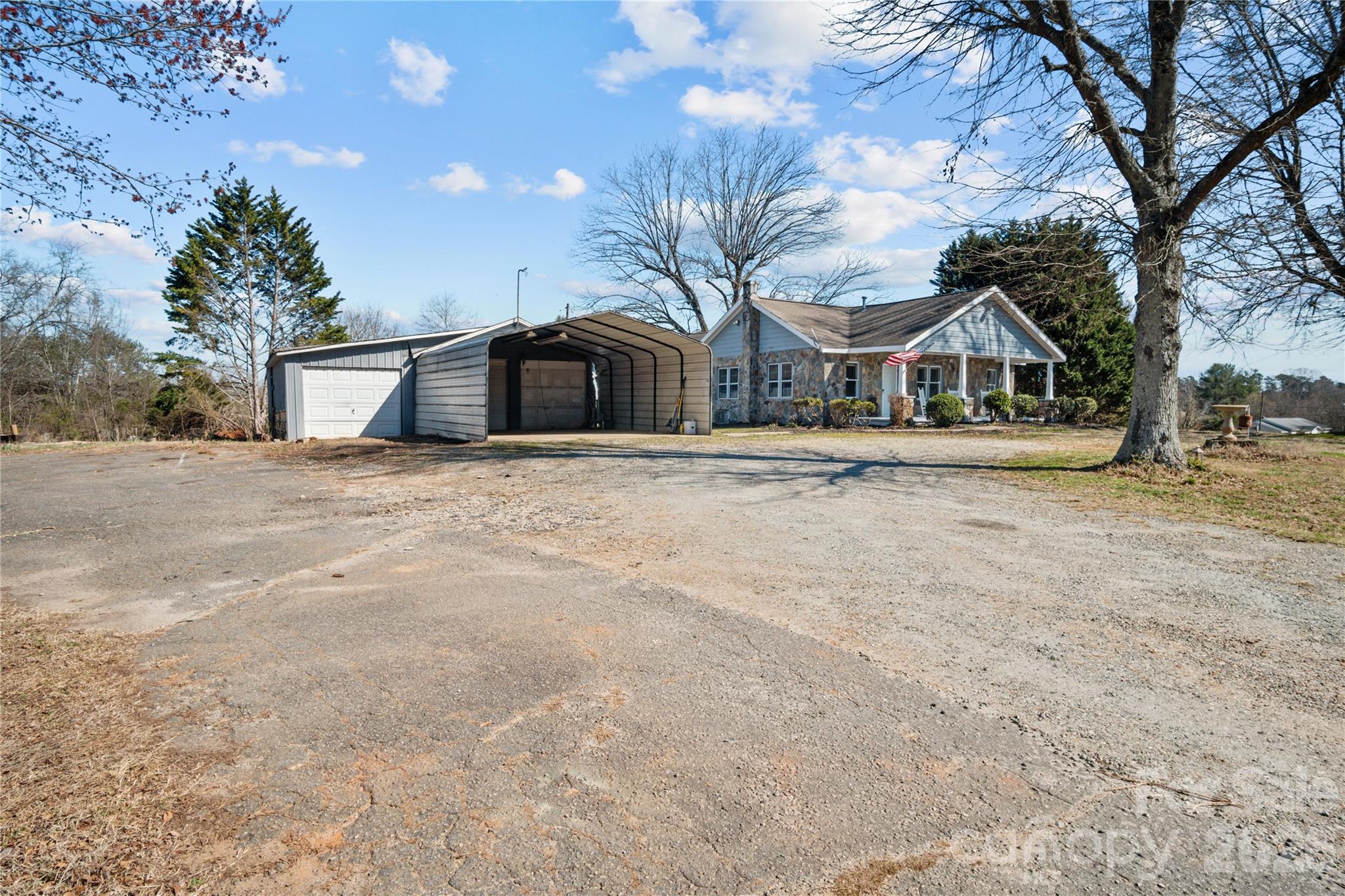 1943 Big Island Road Rutherfordton, NC 28139 - Photo 14 of 35 a front view of a house with a yard and garage