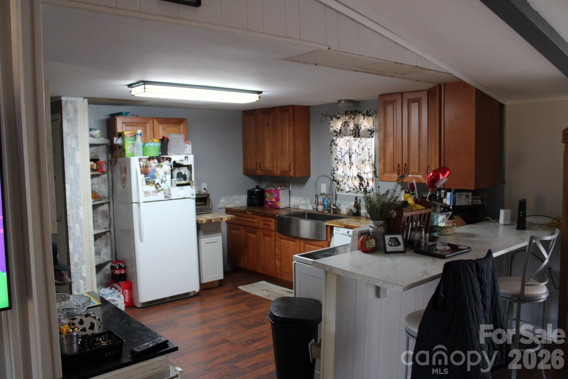 1943 Big Island Road Rutherfordton, NC 28139 - Photo 29 of 35 a kitchen that has a lot of cabinets a sink and a stove in it