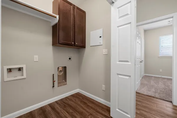 a view of hallway with wooden floor