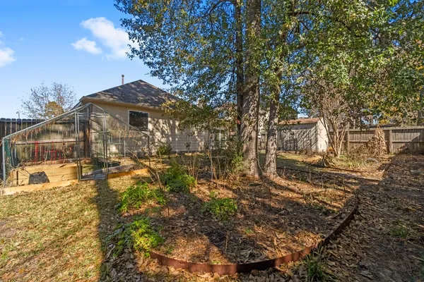 a view of a house with a small yard