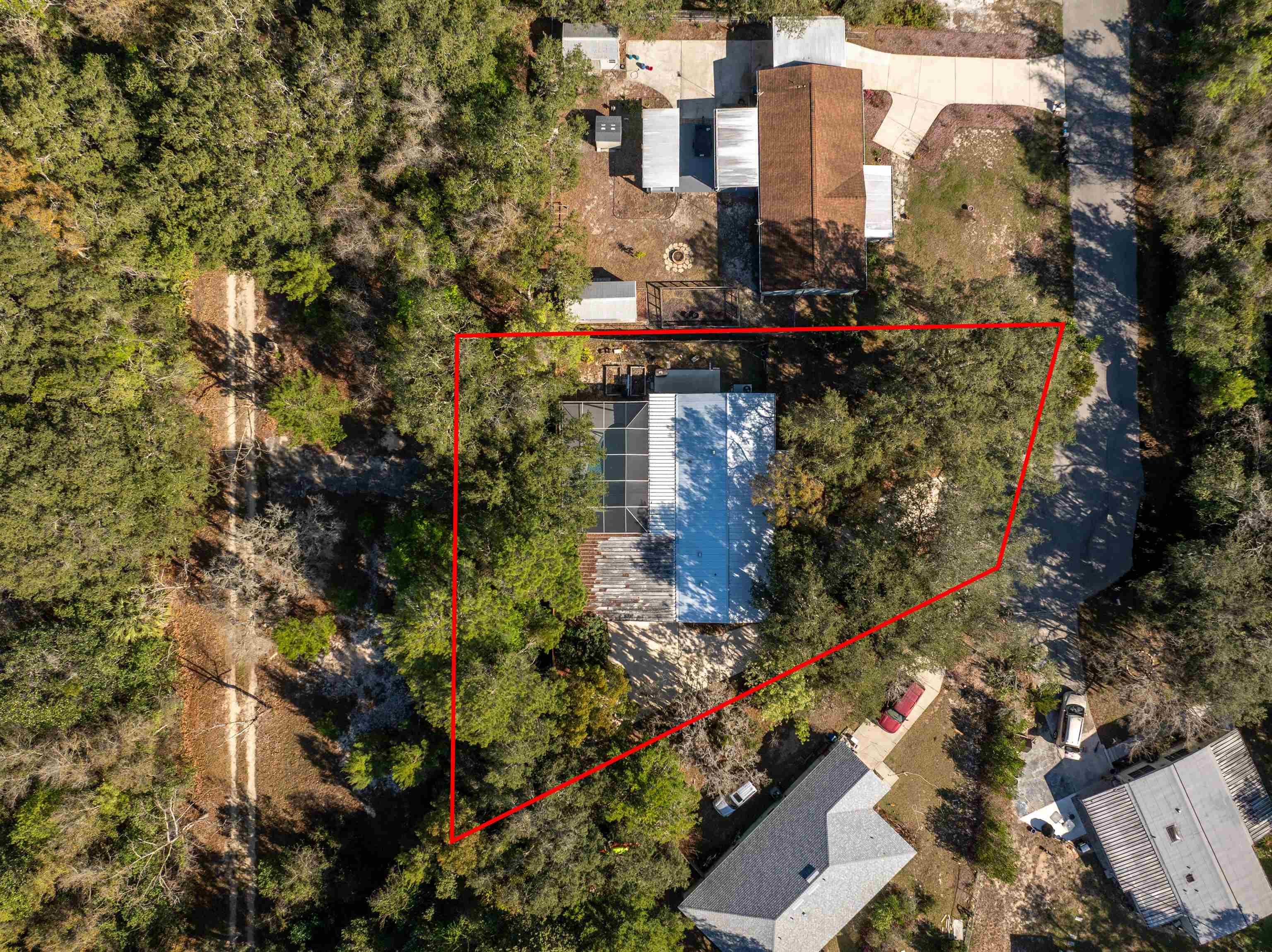 3979 Oak Terrace Road St. Augustine, FL 32086 - Photo 30 of 36 an aerial view of a residential apartment building with a yard and plants