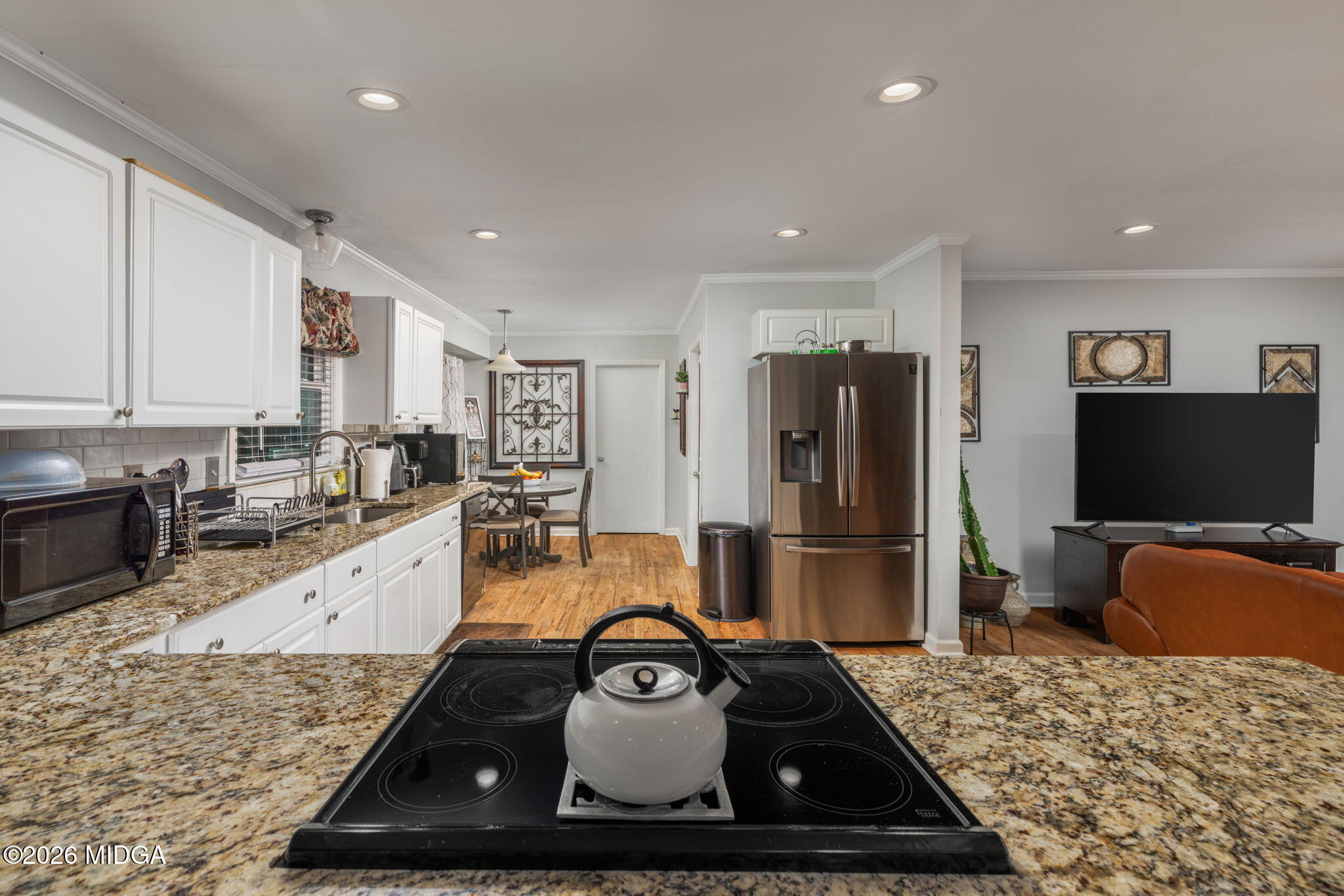 1422 Forest Hill Road Macon, GA 31210 - Photo 11 of 28 a kitchen with a stove a sink and a refrigerator
