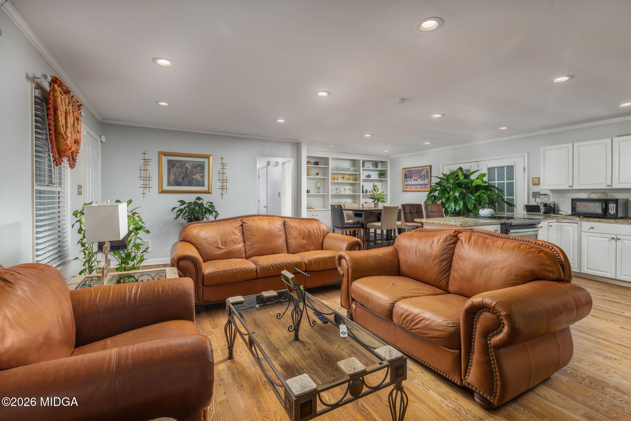 1422 Forest Hill Road Macon, GA 31210 - Photo 8 of 28 a living room with furniture a couch and kitchen view