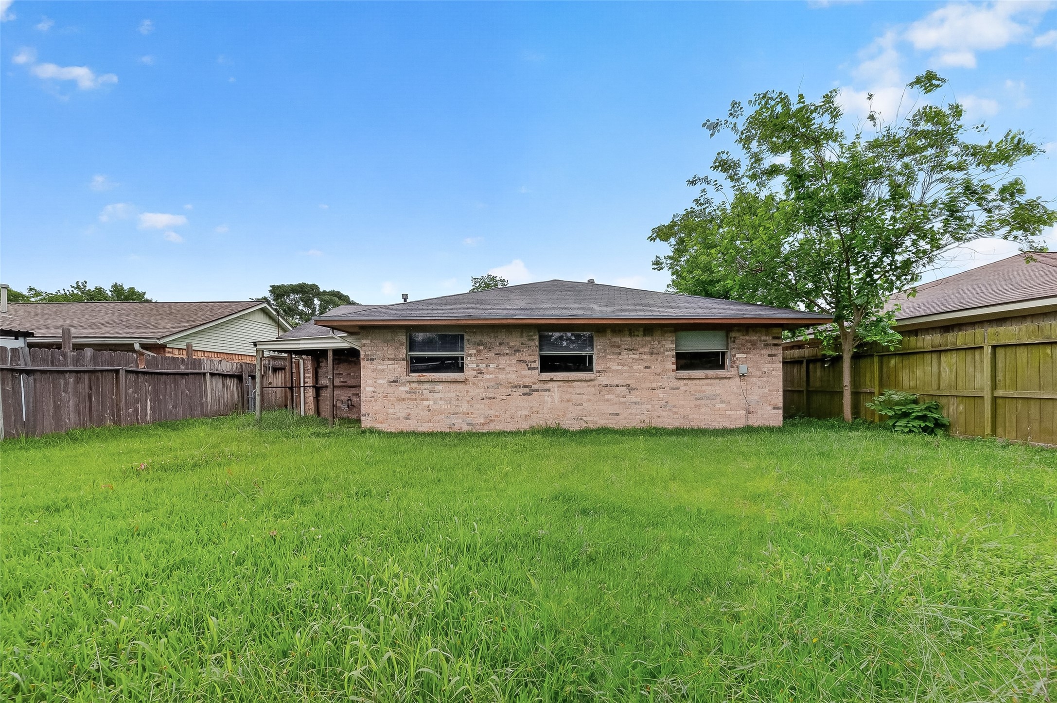 4826 Redfish Reef Drive Bacliff, TX 77518 - Photo 24 of 25 a front view of a house with garden