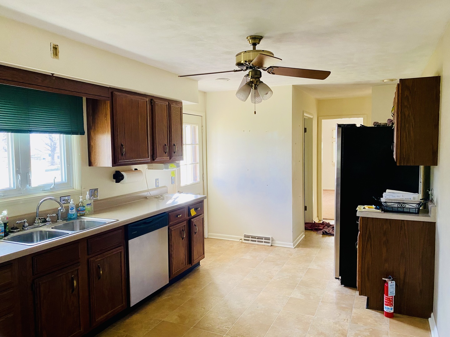 201 Janet Avenue Rochelle, IL 61068 - Photo 4 of 9 a kitchen with stainless steel appliances granite countertop a sink stove and refrigerator