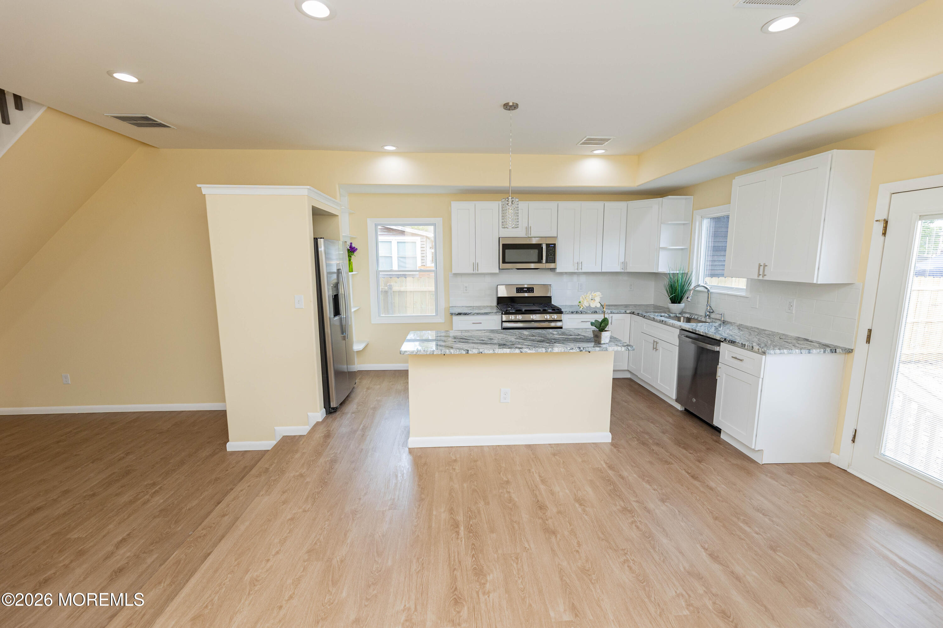 2408 Herbertsville Road Point Pleasant, NJ 08742 - Photo 18 of 82 a kitchen with stainless steel appliances white cabinets a sink a stove a refrigerator and a microwave