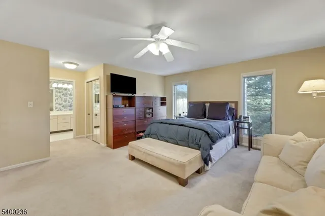 a spacious bedroom with a bed and furniture