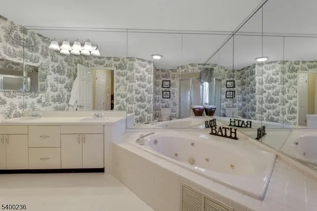 a bedroom with two beds and a window