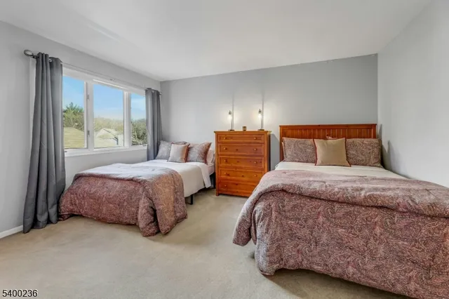 a bathroom with a sink vanity mirror and toilet