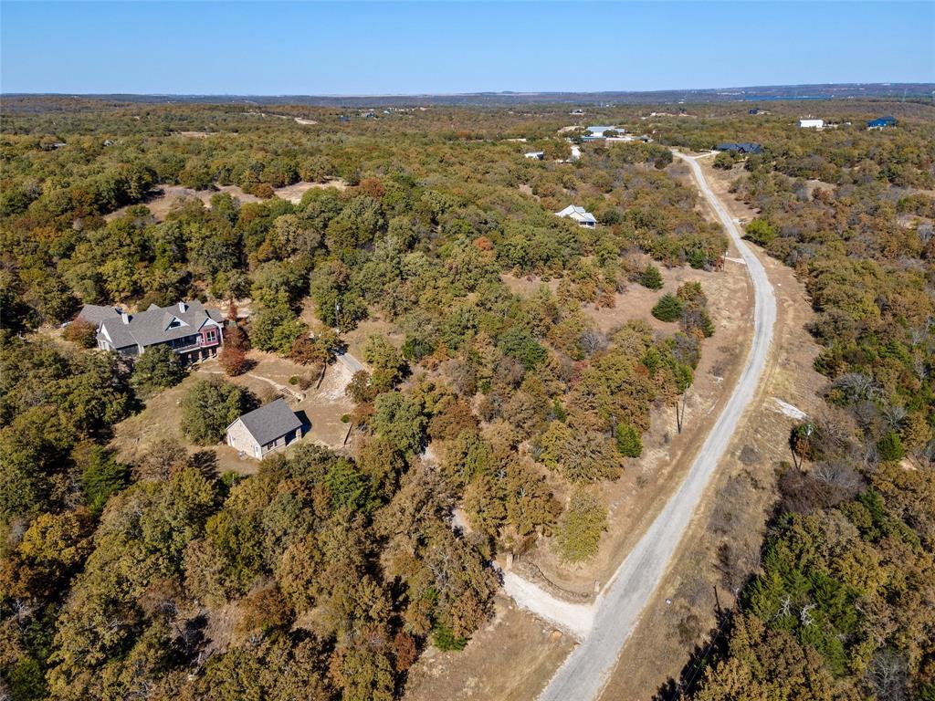 396 Ranchview Court Bowie, TX 76230 - Photo 27 of 38 an aerial view of residential house with ocean view