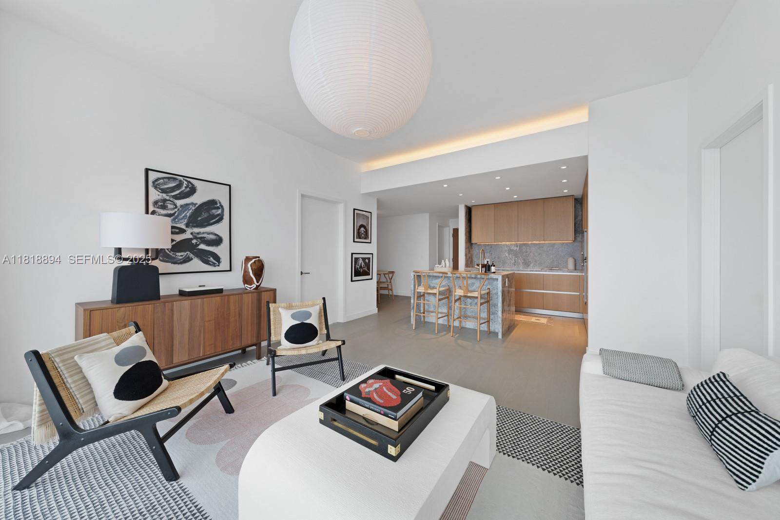 500 Alton Road, Unit 4004 Miami Beach, FL 33139 - Photo 2 of 26 a living room with furniture and a rug