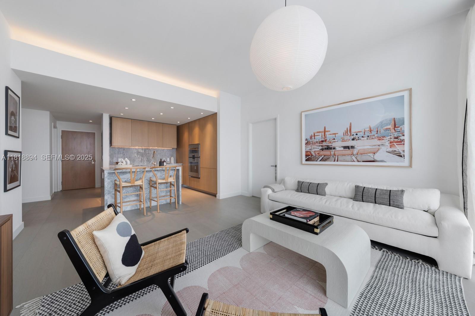 500 Alton Road, Unit 4004 Miami Beach, FL 33139 - Photo 3 of 26 a living room with furniture and a rug