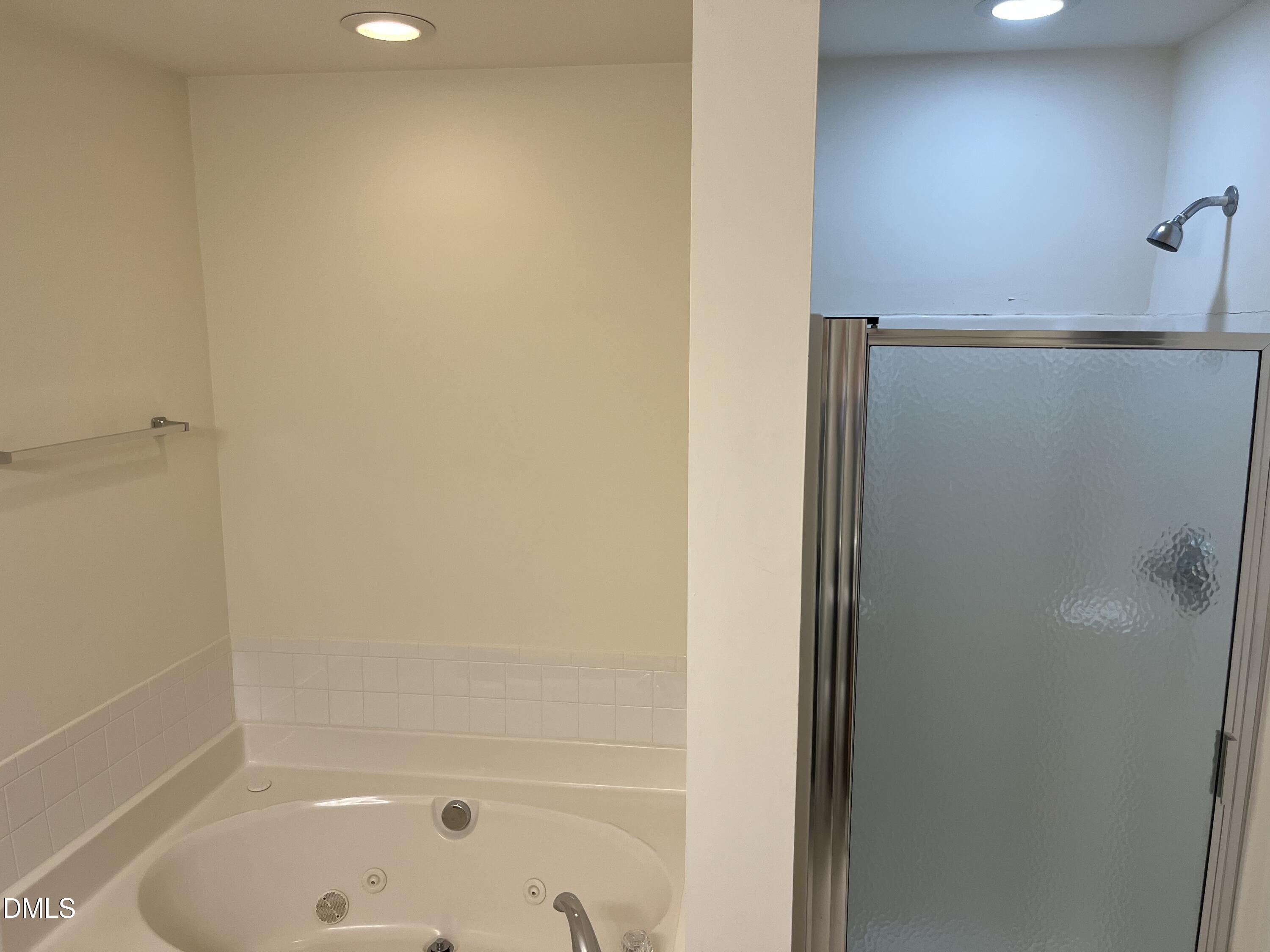 9827 Grettle Court Raleigh, NC 27617 - Photo 10 of 10 a bathroom with a bathtub