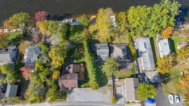 an aerial view of a houses with a lake view