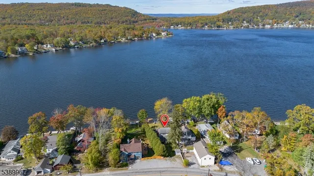 an aerial view of a houses with a street