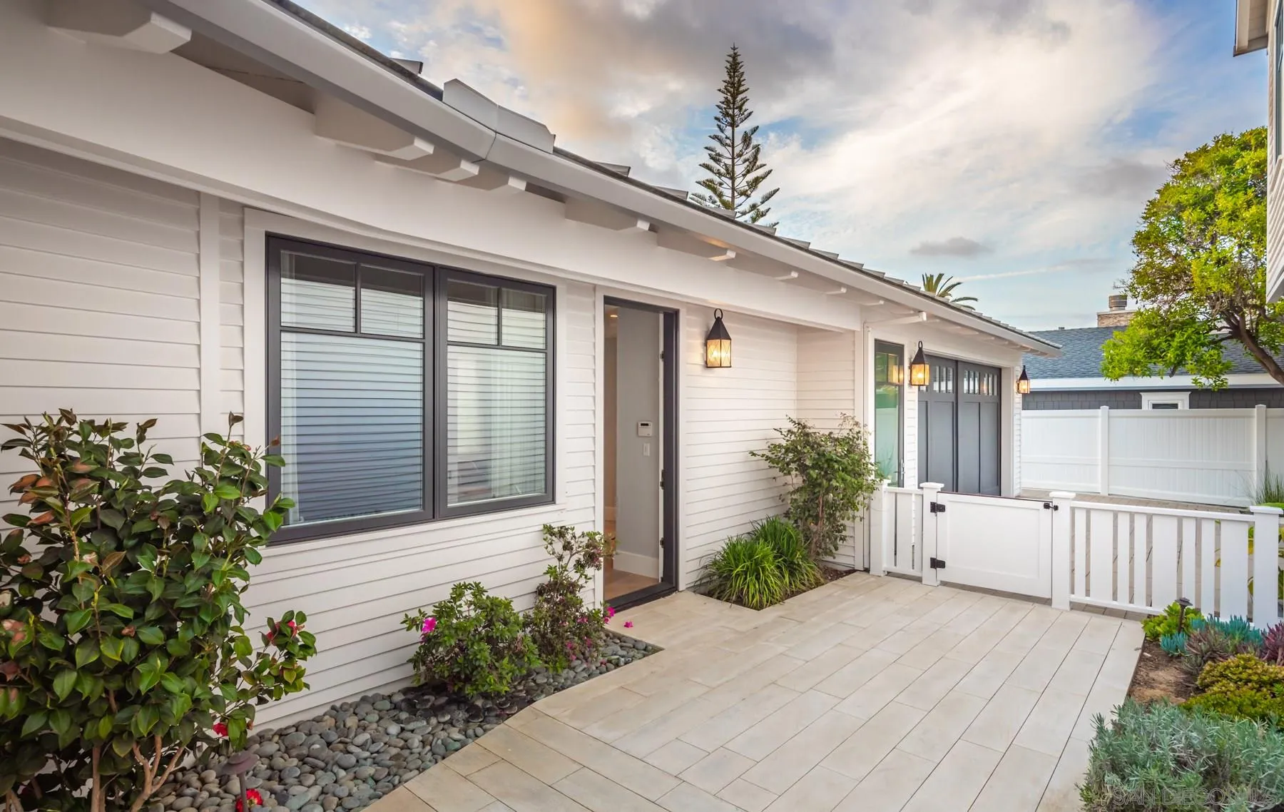 900 Alameda Boulevard Coronado, CA 92118 - Photo 11 of 30 a porch with potted plants and wooden fence