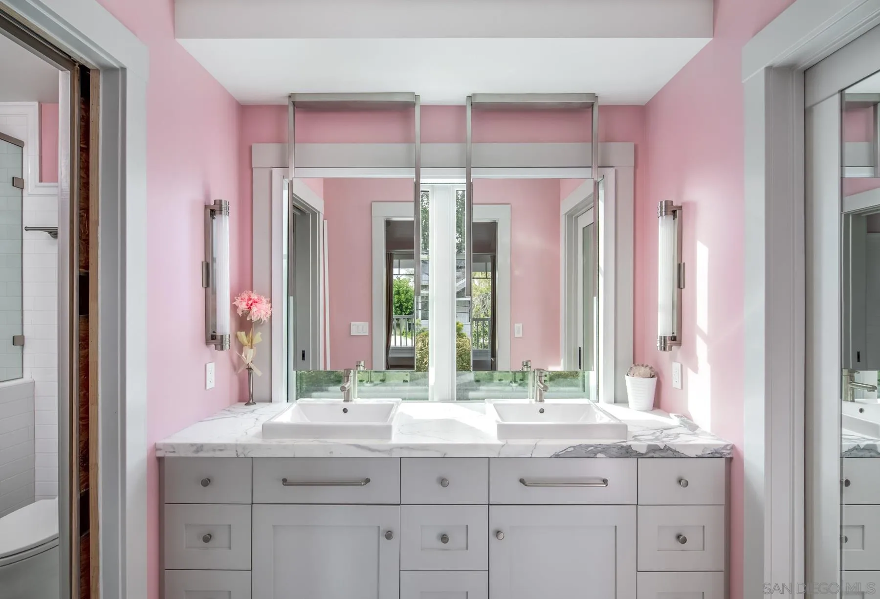 900 Alameda Boulevard Coronado, CA 92118 - Photo 19 of 30 a bathroom with a granite countertop sink and a mirror